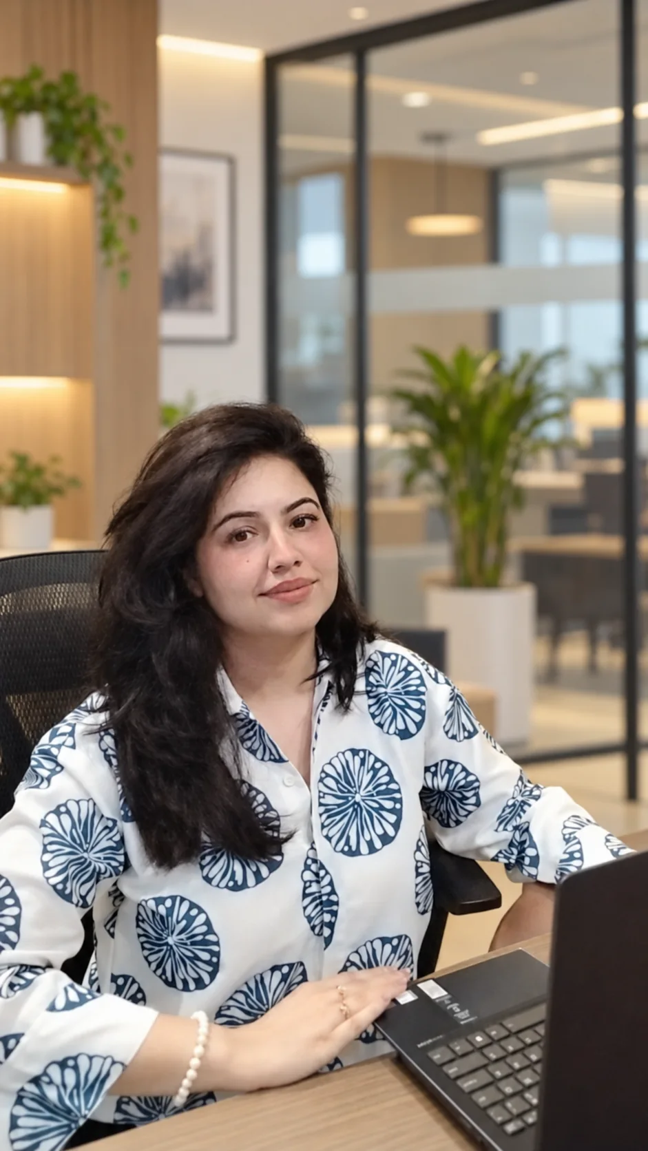 Priyanka Widge seated at her desk